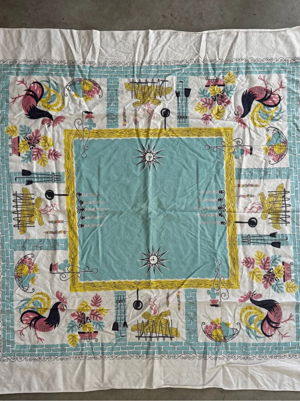 Vintage charming mid-century tablecloth featuring a rooster design with border